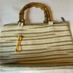 Vintage- Style woven handbag featuring bamboo handles. by Sun and Sand est.1986